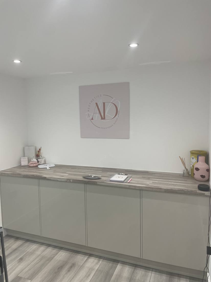 Studio counter with AD Aesthetics logo canvas